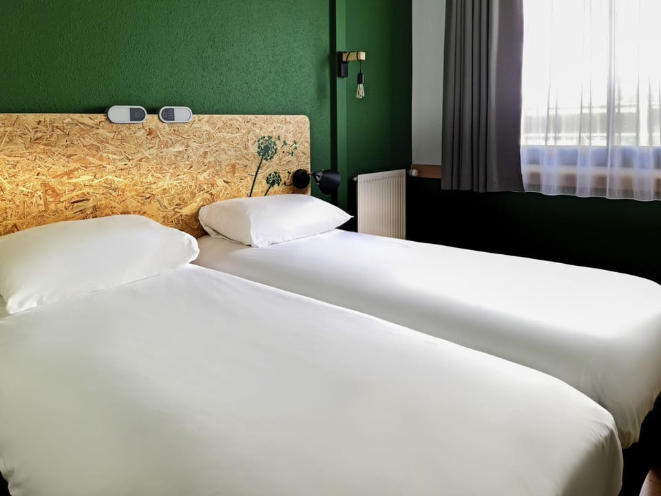 Hypo-allergenic bedding, desk, blackout drapes, soundproofing