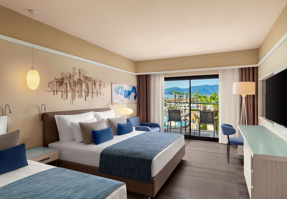 Standard Room, Partial Sea View (Mixed, Spacious Room) | Free minibar, in-room safe, desk, iron/ironing board