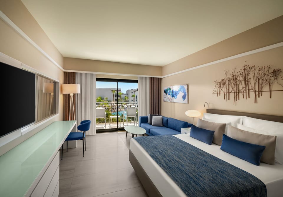 Standard Room, Partial Sea View (Adult) | Free minibar, in-room safe, desk, iron/ironing board