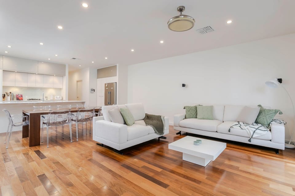 Large living zone space is flooded with natural light