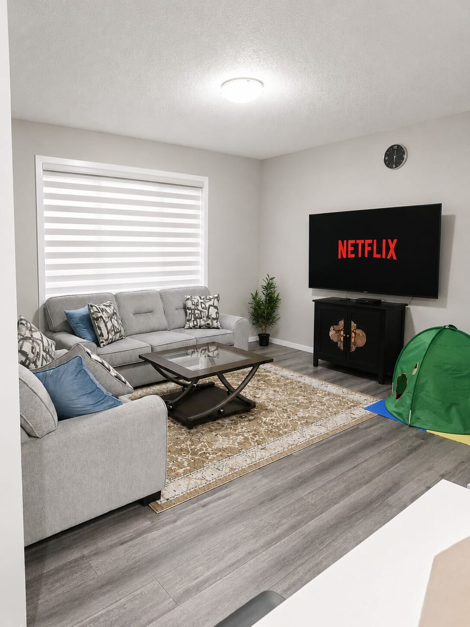 Living room with big window and tv( netflix)