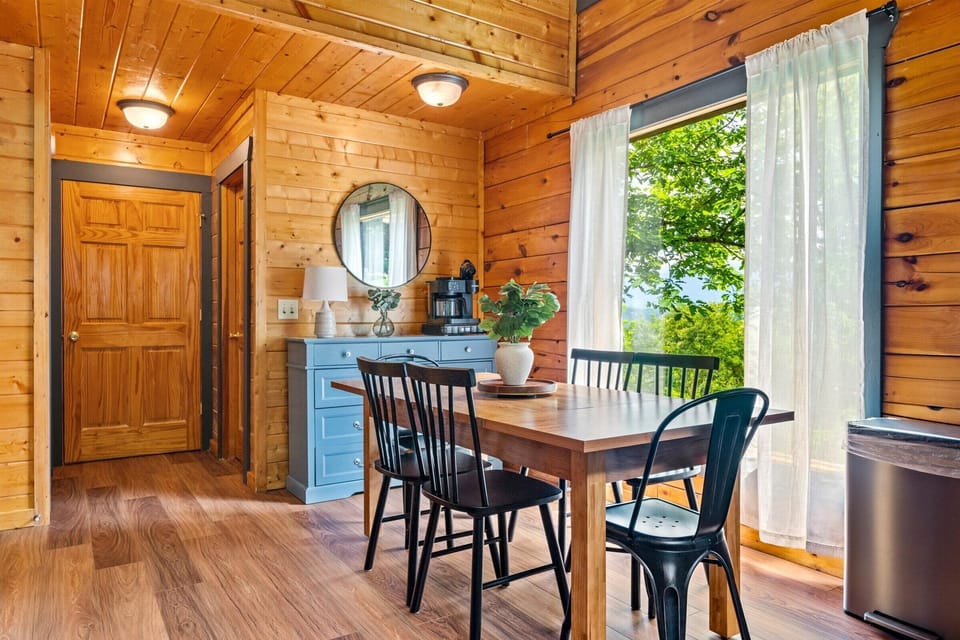 Enjoy the view and natural light as you gather at the dining table.  
