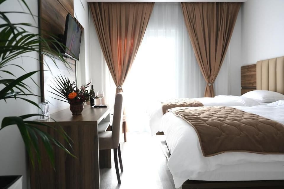 Twin Room, Balcony, Pool View | In-room safe, iron/ironing board, free WiFi