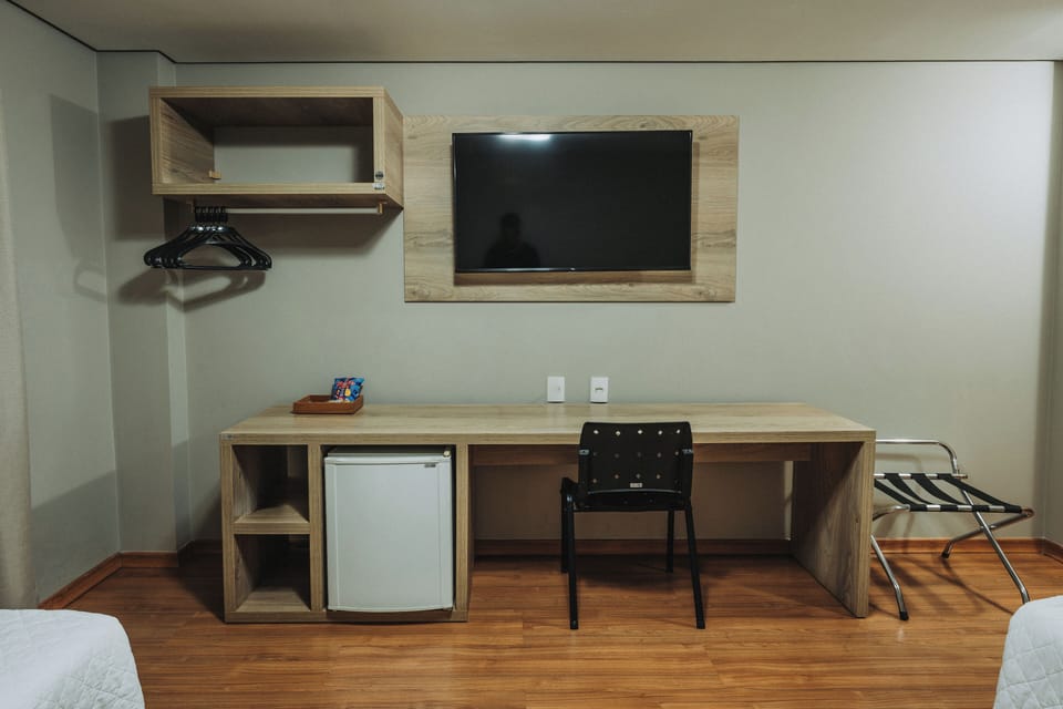 Deluxe Double or Twin Room | Minibar, desk, blackout drapes, iron/ironing board (on request)