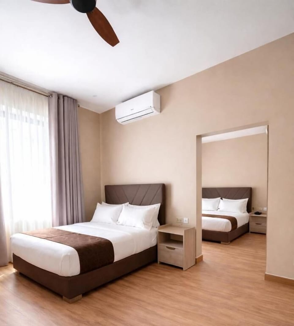 Family Room, City View | In-room safe, blackout drapes, iron/ironing board, free WiFi