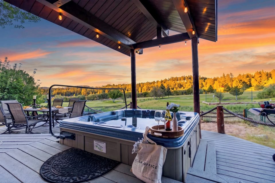 Unwind in the private hot tub, fire up the grill, and enjoy sweeping fairway and mountain views from the covered patio.