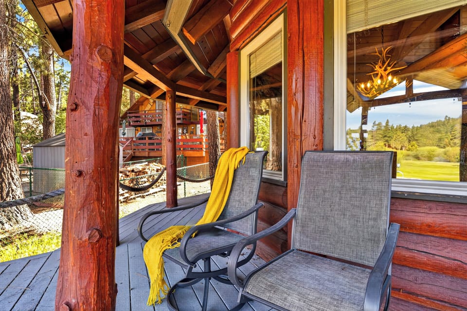 Sip your morning coffee on the covered porch while taking in peaceful forest and fairway views.