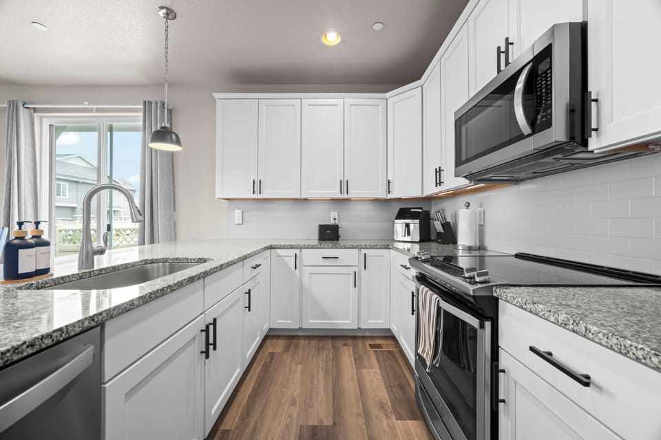 Fully equipped kitchen with plenty of space for cooking and gathering.