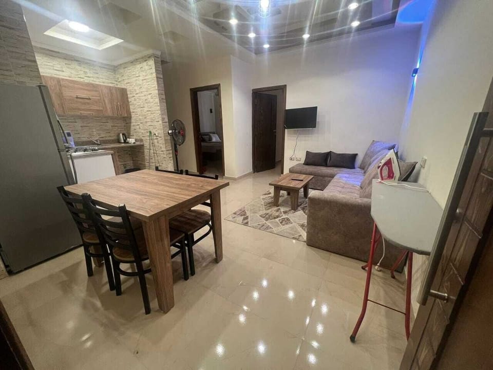 Deluxe Apartment, City View | Living area | 30-cm flat-screen TV with satellite channels, TV