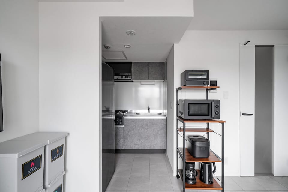 Apartment | Private kitchen | Fridge, microwave, stovetop, cookware/dishes/utensils