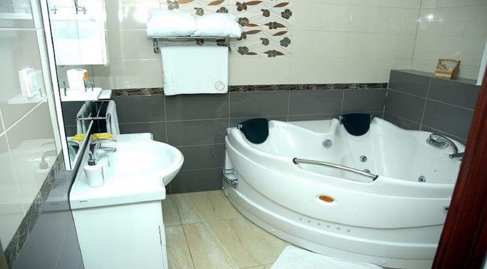 Deluxe Room | Bathroom | Bathtub, deep soaking tub, free toiletries, hair dryer (on request)