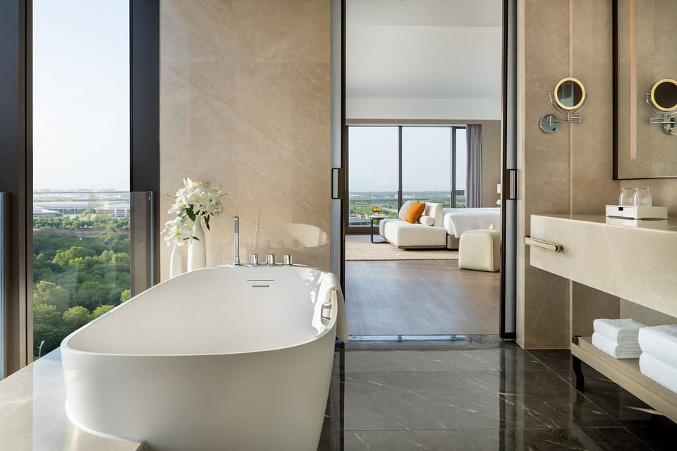 Executive Room, 1 King Bed (King) | Bathroom | Combined shower/tub, hair dryer, bathrobes, slippers