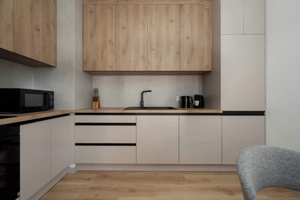 Front view of the fully equipped kitchen offering ample storage and workspace.