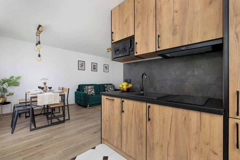 Modern kitchenette equipped with everything needed for cooking during your stay.