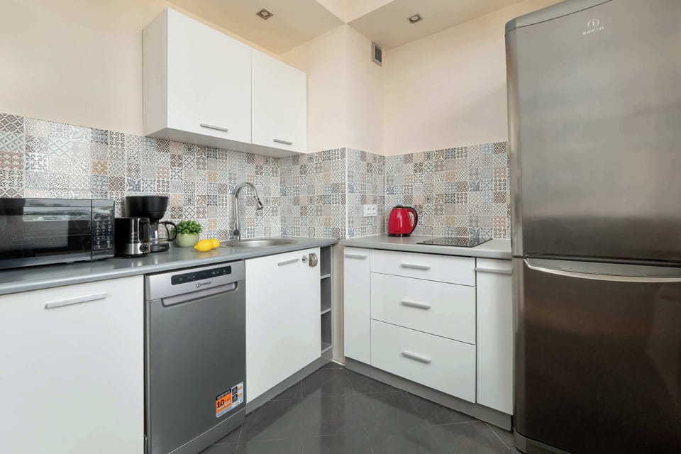 Fully equipped modern kitchen with everything needed for cooking and dining at home.
