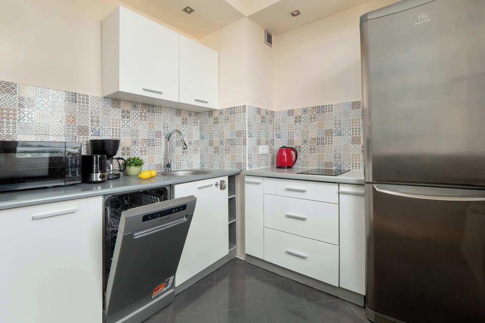 Contemporary kitchen featuring modern appliances and generous workspace.