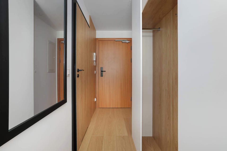 Stylish hallway leading to the apartment with premium residential finishes.