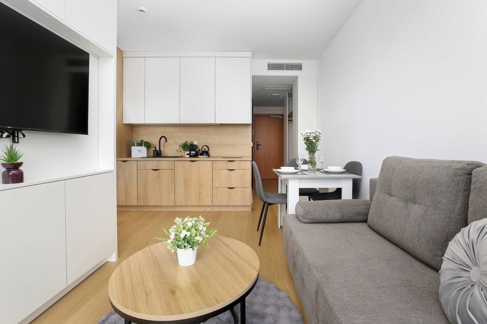 Bright living area with comfortable seating and contemporary Scandinavian-inspired design.