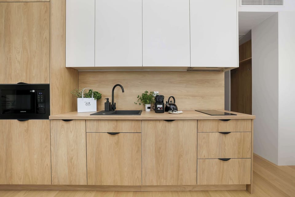 Contemporary kitchen with modern appliances, ideal for short and long-term stays.