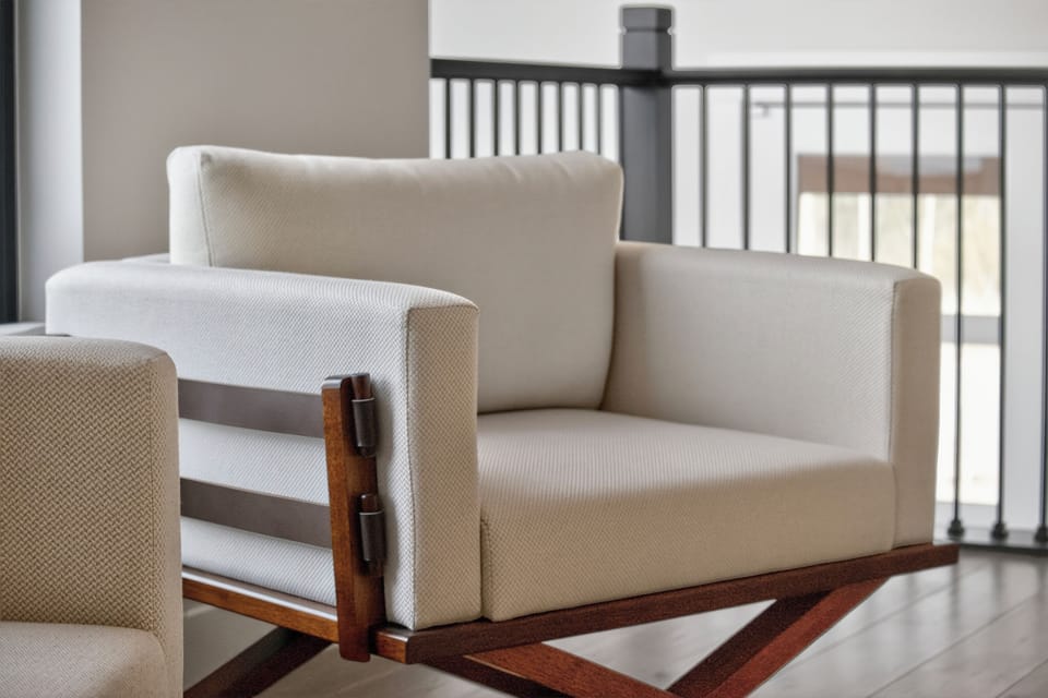 Sink into plush seating where modern design meets comfort. Your private balcony overlooks peaceful views, inviting quiet moments of relaxation.
