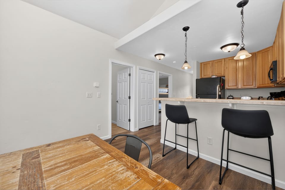 Step into your bright, open-concept space where warm wood tones and modern finishes create a welcoming home away from home. The kitchen flows seamlessly into the dining area, inviting you to gather and savor every moment.
