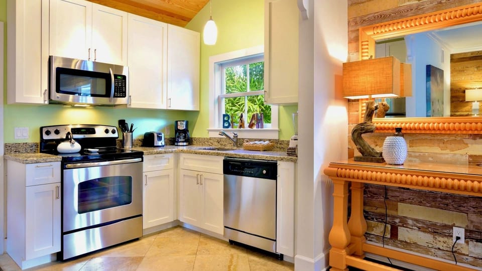 Your fully equipped kitchen features stainless steel appliances, granite countertops, and plenty of cabinet space—perfect for preparing home-cooked meals during your getaway.