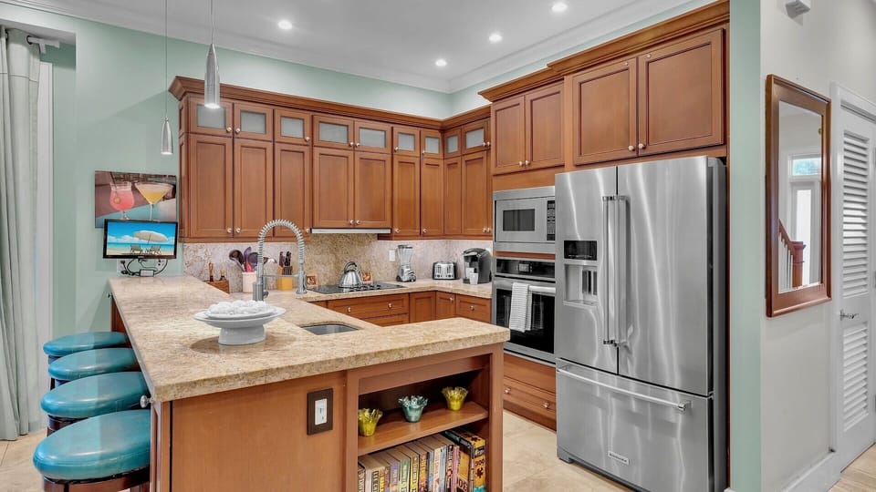Your gourmet kitchen features granite countertops and stainless steel appliances....