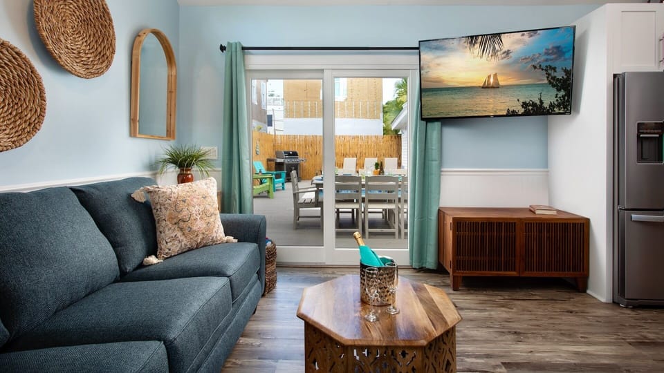 The Queen - The living area opens up to the pool...