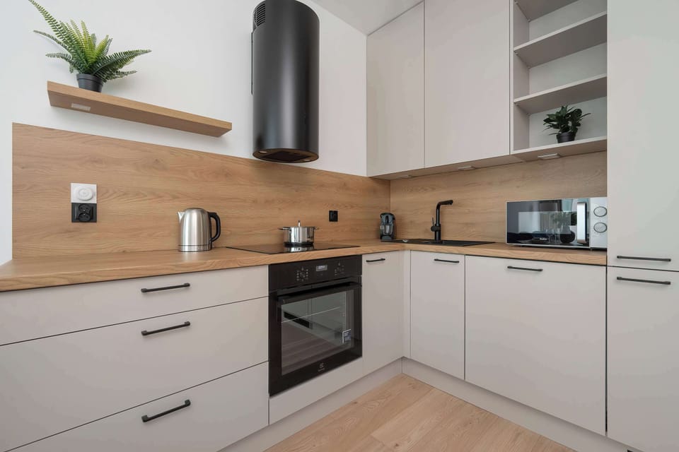Cook and dine in style with the modern kitchenette and dining area.
