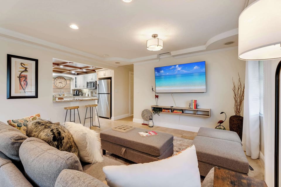 Unwind in our bright, modern living room featuring sleek finishes and comfortable seating.