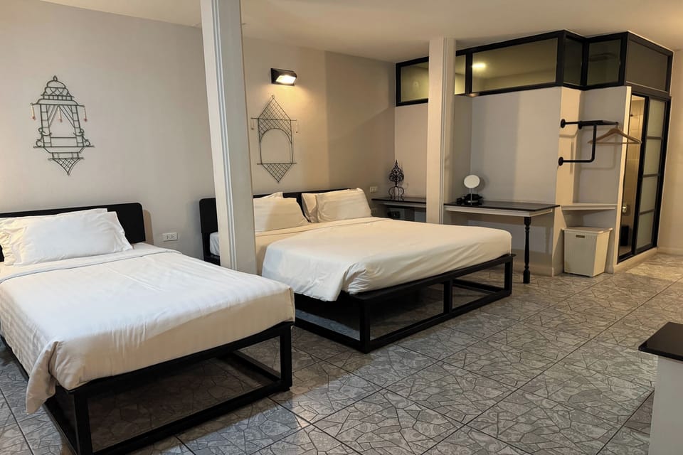 Triple Room | Minibar, in-room safe, desk, iron/ironing board