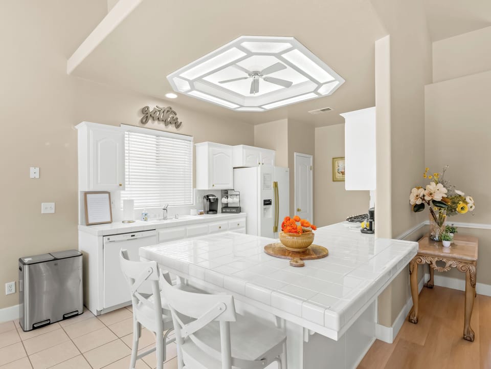 "The fully equipped kitchen offers plenty of space to cook, gather, and connect. Enjoy casual breakfasts at the oversized island or prepare family meals while staying part of the conversation in the open living areas.