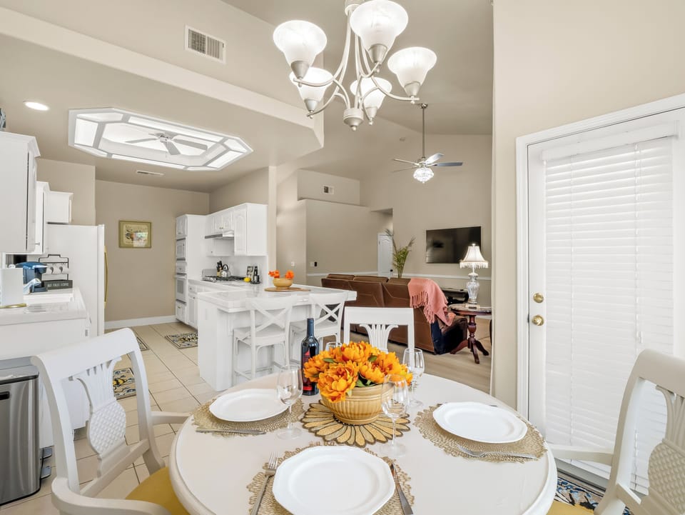Enjoy meals together in this bright dining area that seamlessly connects to the kitchen and living room. The open layout keeps everyone connected, whether you're sharing breakfast, dinner, or planning the day's adventures.