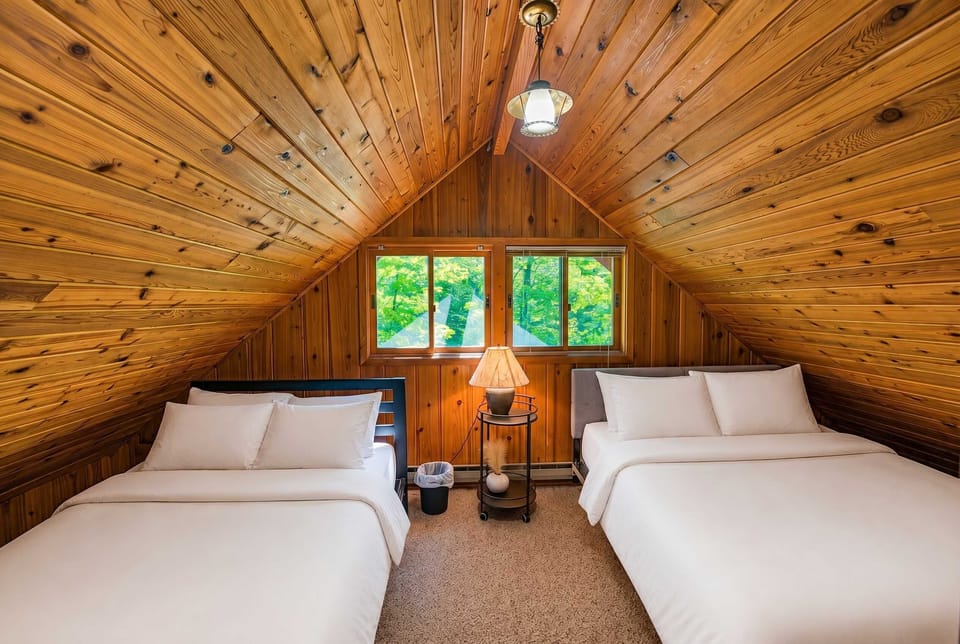 Bedroom 4 - Two beds tucked under the cabin loft with treetop views — the kids will never want to leave this room