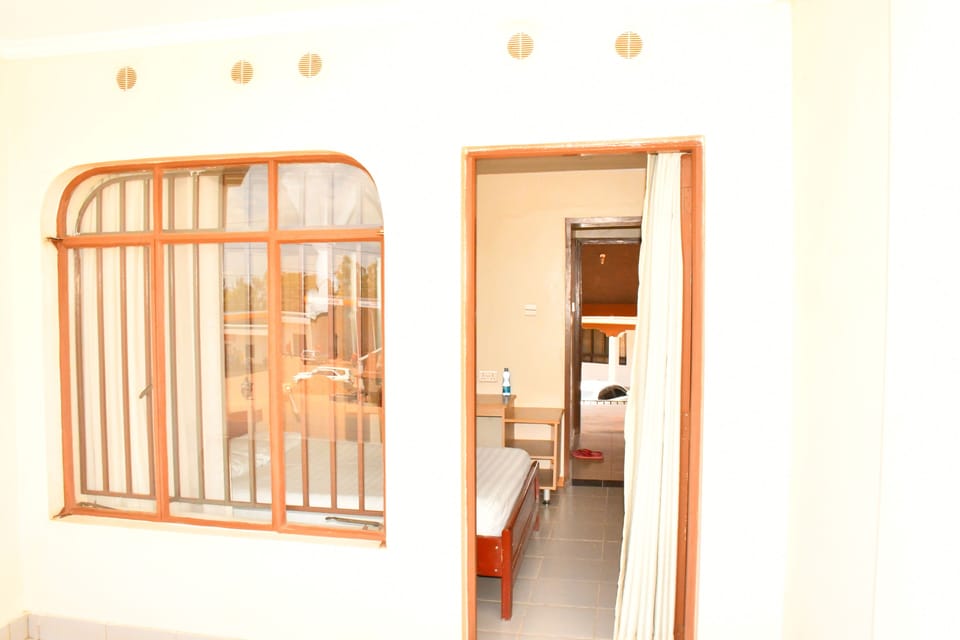 Deluxe Room, Patio, Garden View | Desk, laptop workspace, free WiFi