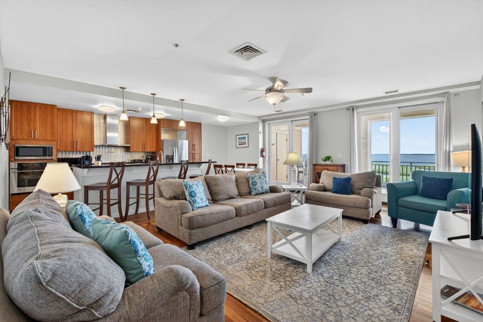Start your morning with coffee and coastal views as the first light of day fills this spacious waterfront retreat.