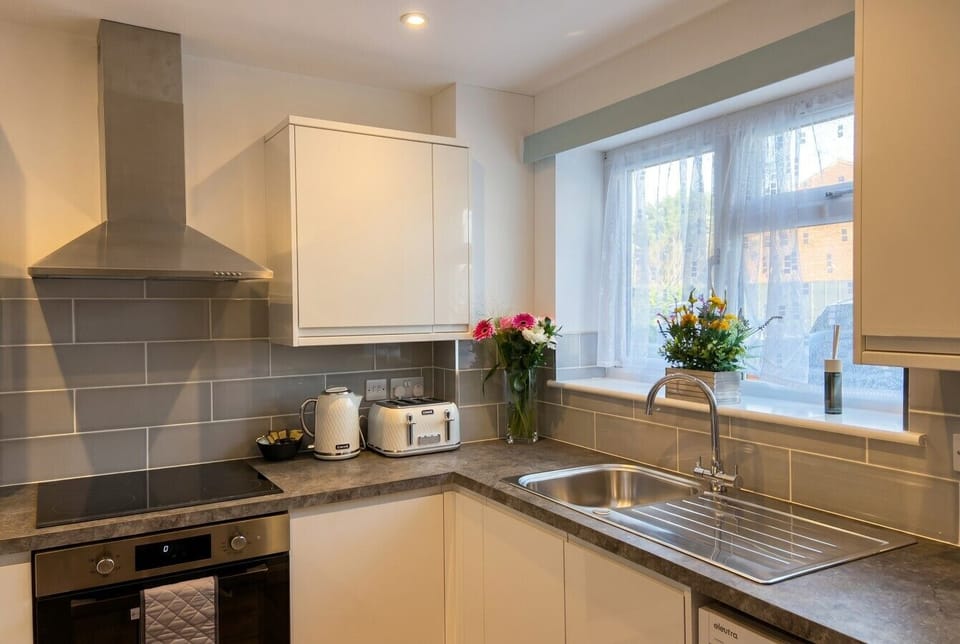 Light kitchen with a garden window and everything you need to cook