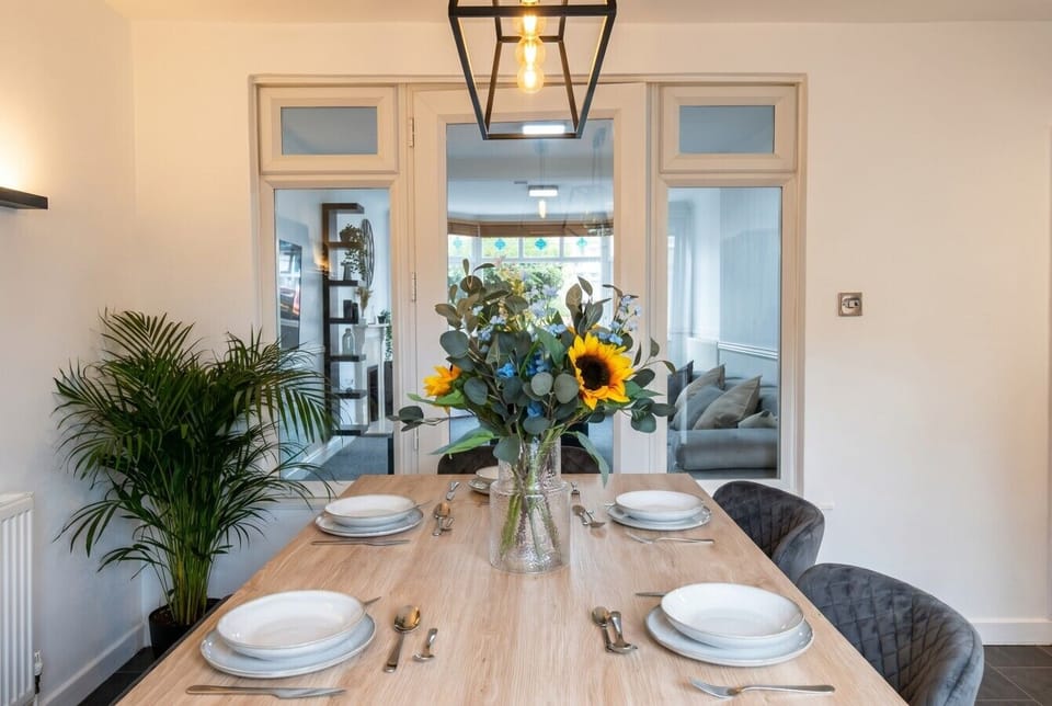 Sunflowers and a striking pendant set the scene for memorable shared meals.