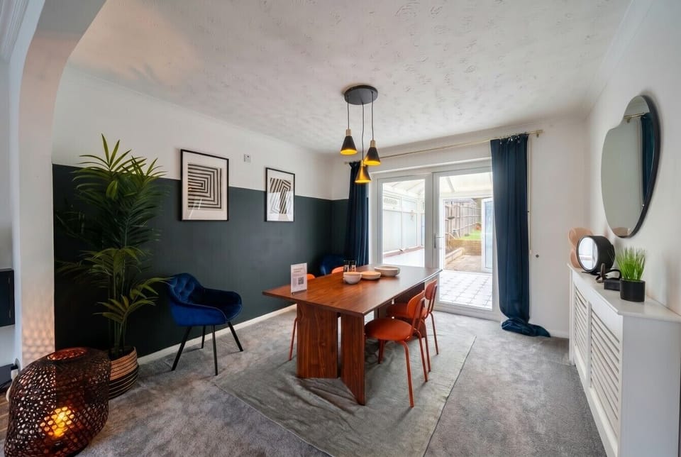 Elegant dining space with statement art and garden access just steps away.