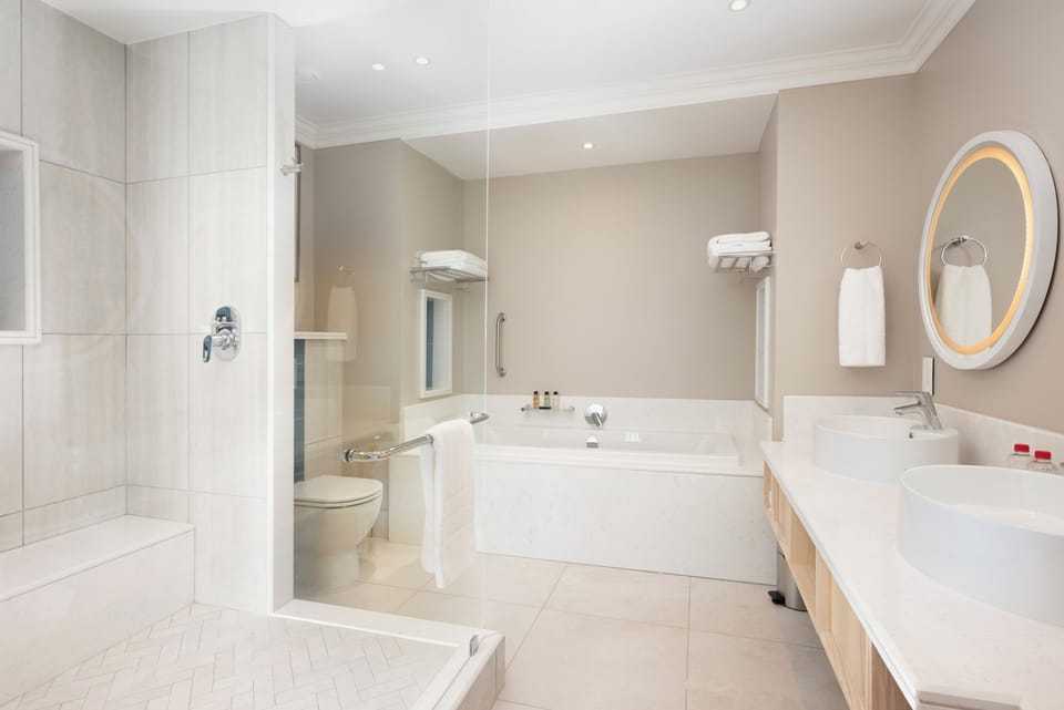 Suite | Bathroom | Rainfall showerhead, hair dryer, towels, soap