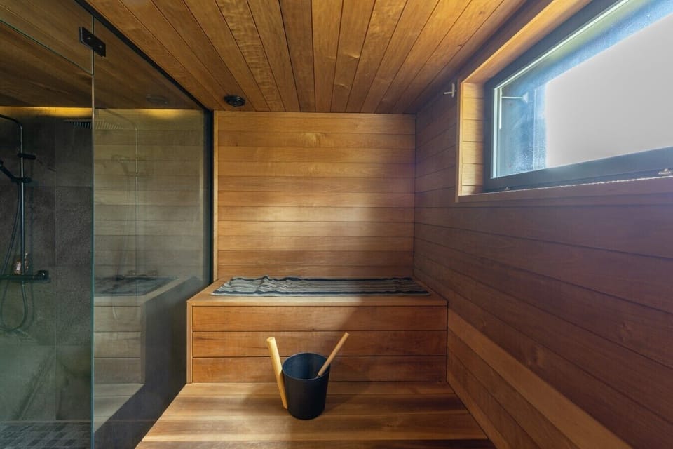 Sauna with a glass wall to the shower
