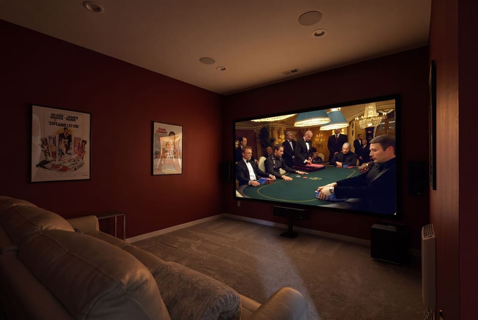 Private home theater with plush seating and a big-screen cinema feel
