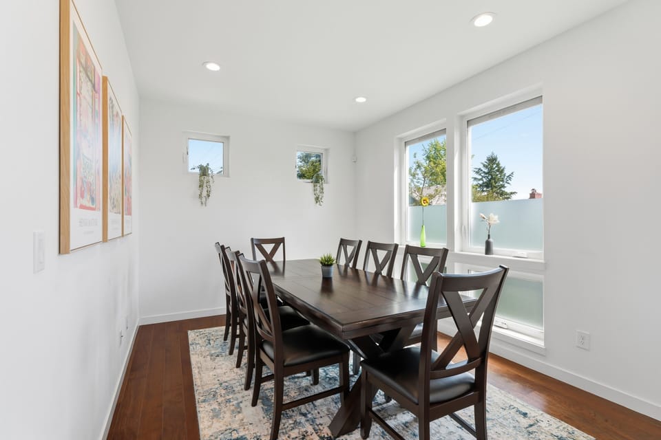 Bright modern dining room with seating for six and abundant natural light