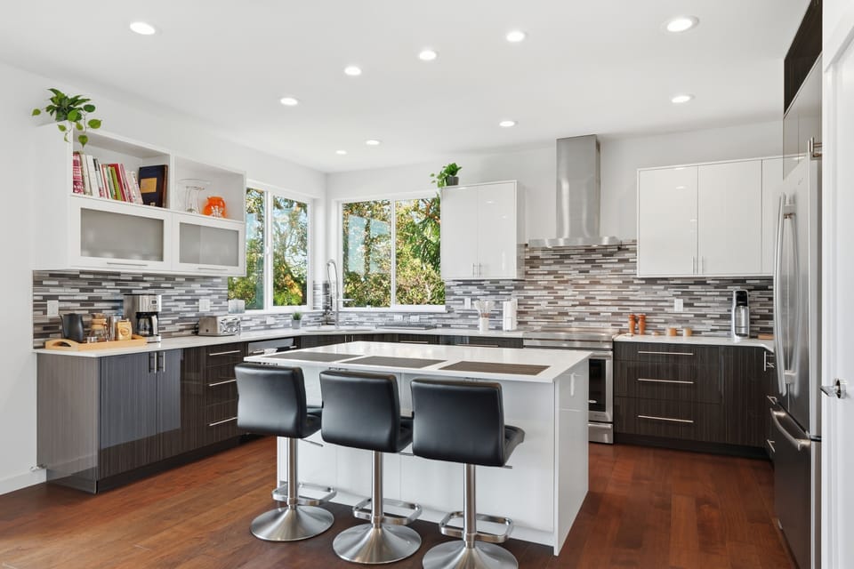 Bright modern kitchen with island seating and beautiful natural light
