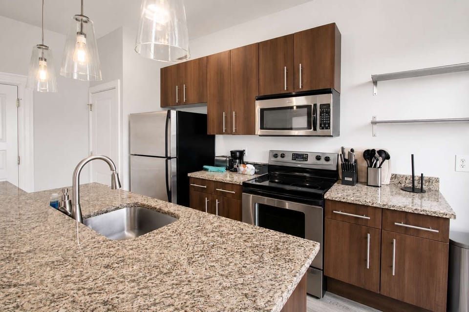 Kitchen — granite counters and a window over the sink