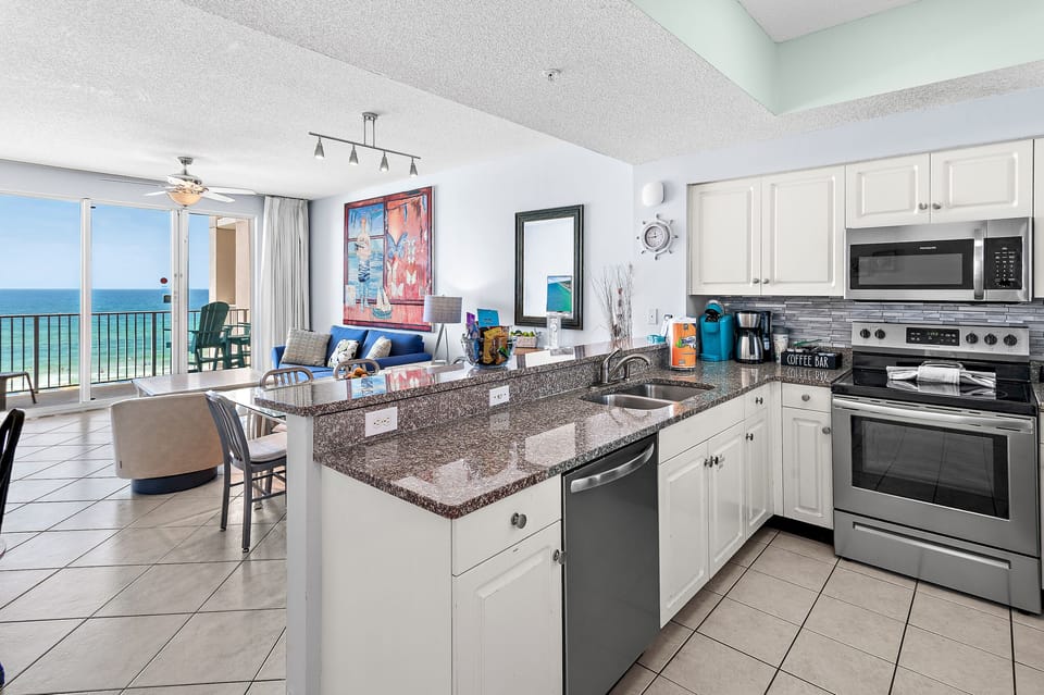 Kitchen has GULF VIEWS, granite countertops, stainless appliances - fully stocked with more than the basics (coffee/tea bar, oils/salt and pepper, plenty of pots/pans/cookware)