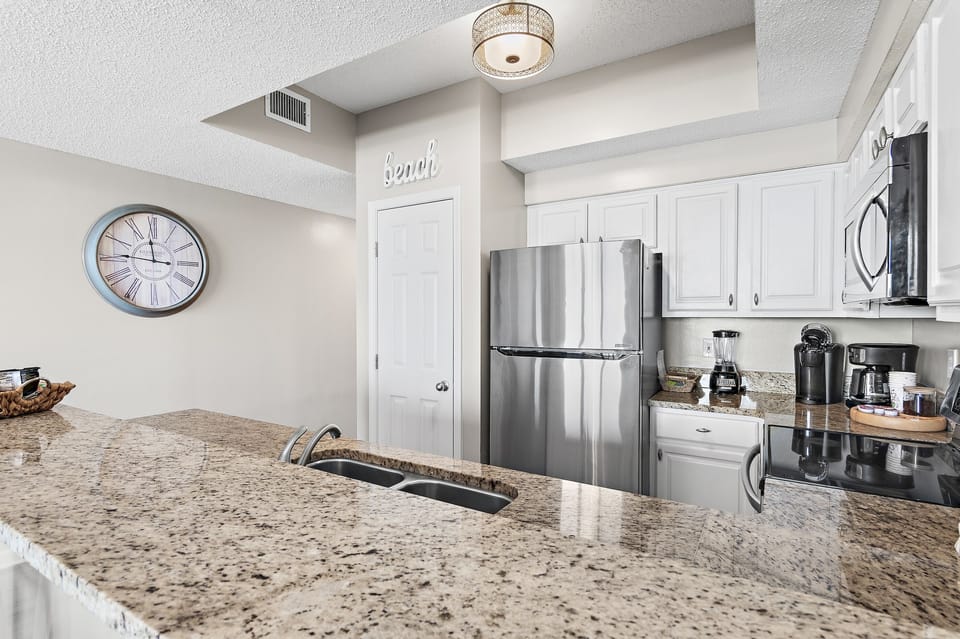 Kitchen has GULF VIEWS, granite countertops, stainless appliances - fully stocked with more than the basics (coffee/tea bar, oils/salt and pepper, plenty of pots/pans/cookware)