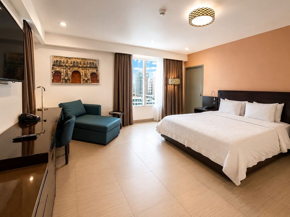 Deluxe Room, City View | In-room safe, desk, soundproofing, iron/ironing board