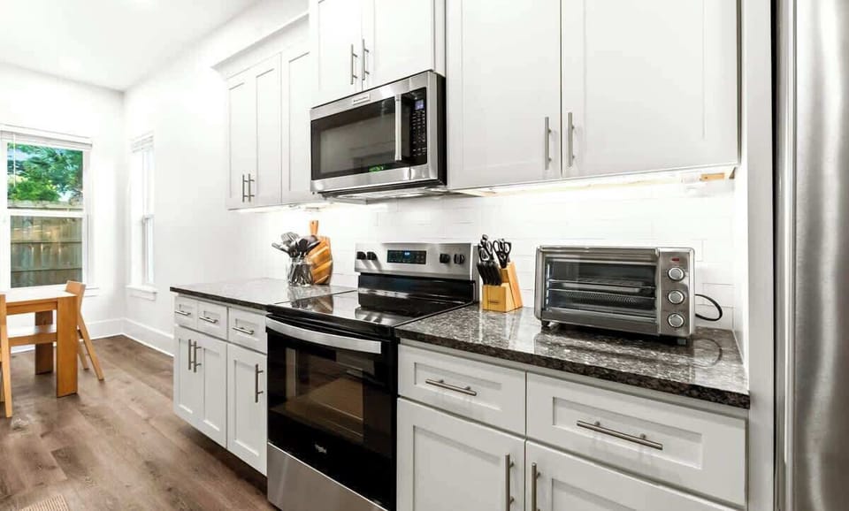 Kitchen: Drip coffee maker, Keurig, blender, toaster oven, Crockpot, tableware 