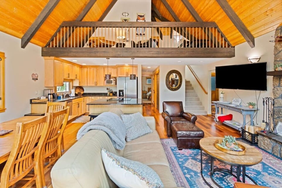 Bright and open gathering space beneath vaulted wood ceilings.